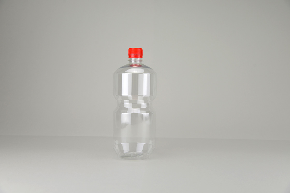Bouteille en PET transparente 1 litre avec bouchon inviolable rouge